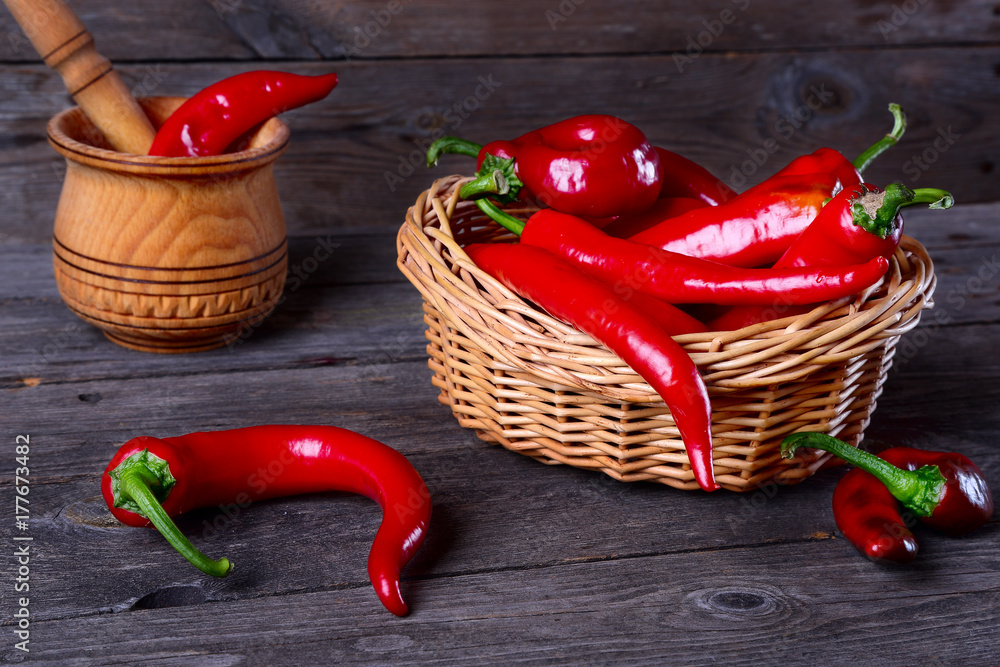 Wall mural red chili pepper on a kitchen table