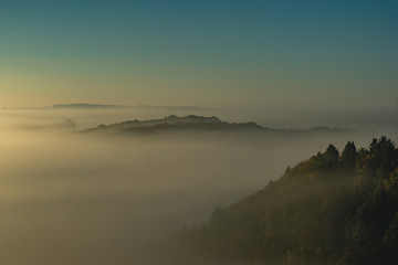 mountains in the foggy golden hour