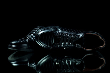 Black shoes on a black background.