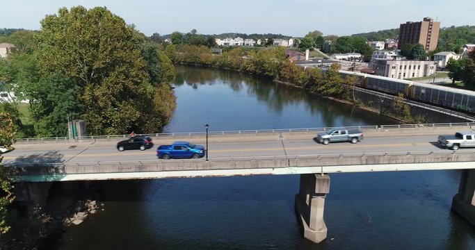 A profile aerial view of traffic on the Officer McCray Rob Memorial Bridge over the Youghiogheny River in Connellsville, PA.  	