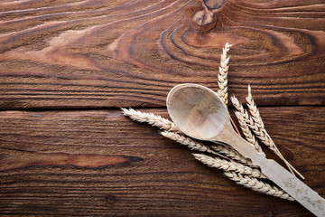 Wheat, oats, corn. On a wooden surface. Top view. Free space for your text.