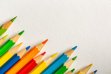 Background with colored pencils and bright paper