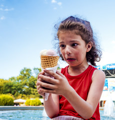 Happy little boy with ice cream. The concept of emotions.