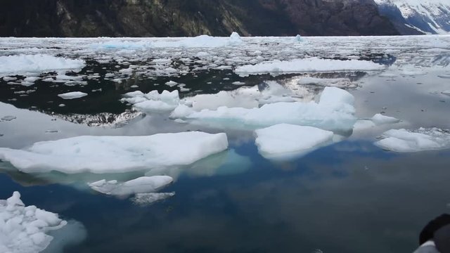 Glacier in Alaska with water reflection landscape