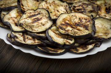 Aubergines eggplants and slices grilled on the plate