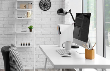 Comfortable workplace with modern computer on table