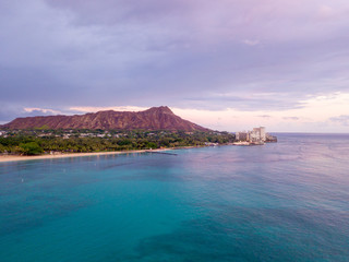Purple Diamond Head sunset aerial view over Waikiki beach