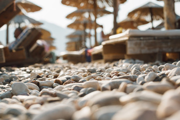 sunbeds and straw umbrellas on beach