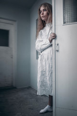 mentally ill girl with straitjacket in a Psychiatric
