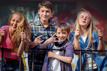 Portrait of happy fashion teens having fun 