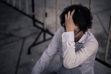 business man is stressed from his work. depression and anxiety concept.