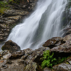large Waterfall from ravine in autumn, long exposure