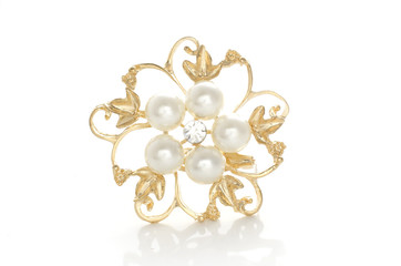 gold brooch flower with pearl isolated on white