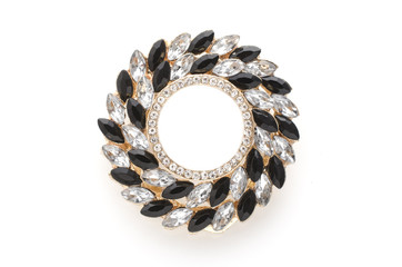 round brooch with gems isolated on a white background