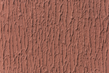 The texture of the putty with the red paint