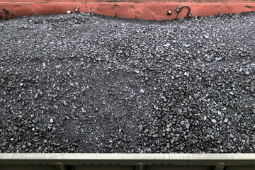 Charcoal carriage
Horizontally.Vid from above. Black coal immersed in freight cars, located on the tracks.