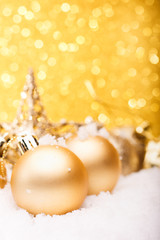 Fototapeta na wymiar Christmas composition of Christmas tree toys on a gold background