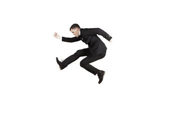 Fototapeta na wymiar American businessman jumping in the studio