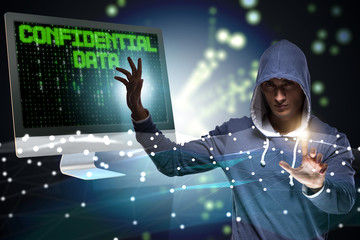 Hooded hacker in data computer security concept