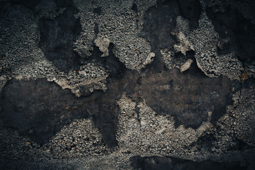 Black wall background. Grunge texture with stone and old iron parts