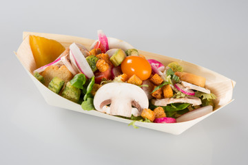 salad to go in takeaway container on white background