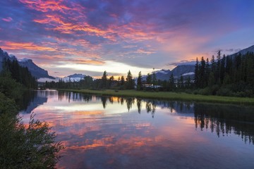 Alberta Foothills Dramatic Burning Red Sunset Sky Landscape in City of Canmore after late afternoon Canadian Rockies summer thunderstorm 