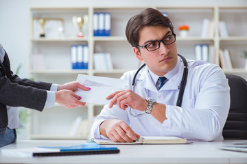 Young doctor in medical insurance fraud concept