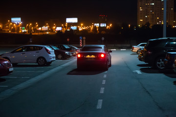 Cars at night in a parking lot - 177687278