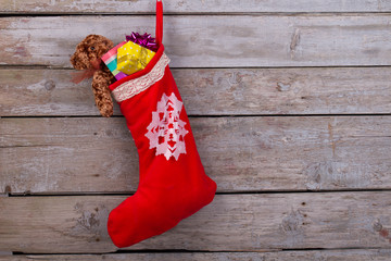 Red stocking filled with gifts - 177688018