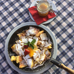 Famous Austrian dish Kaiserschmarrn served in a pan