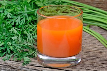 Carrot juice in a glass on table