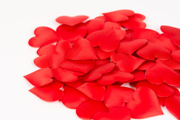 Pile of red hearts isolated above white background. Love and romantic red hearts background