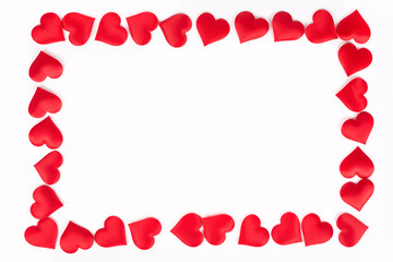 Frame made of little red hearts isolated above white background