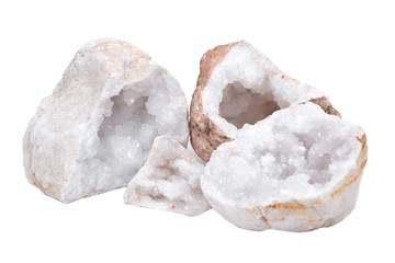 Collection of clear crystal quartz geodes with crystalline druzy center isolated on white background