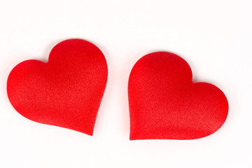 Two red hearts isolated on the white background