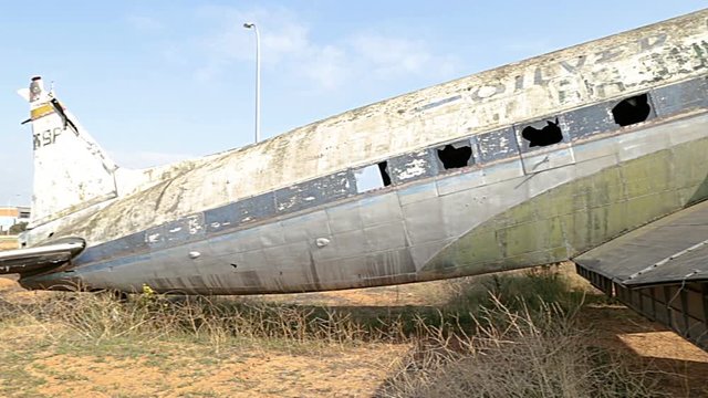 Old  and damaged spanish airplane on the disused airfield