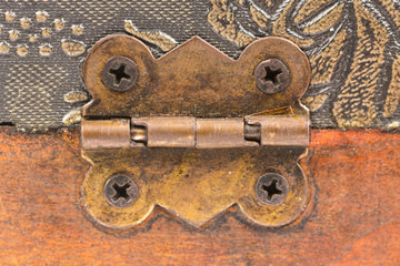 Ancient metal hinges on a wooden suitcase