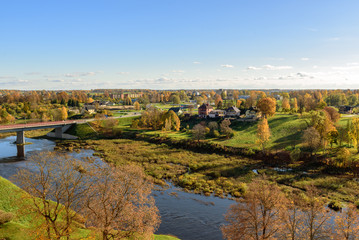 Aerial view on panorama of autumn valley with river and bridge near Bauska town, Latvia