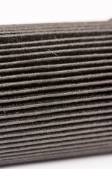 Old used and dirty car fuel filter isolated above white background