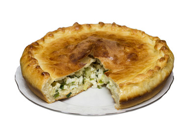 Savory pie with chicken,  onion and egg on a white background.