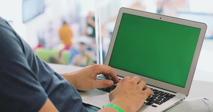 Man using laptop closeup notebook green screen chromakey typing mockup information technology adware cookies driver e-business email firewall login online provider virus application developer wifi 3g