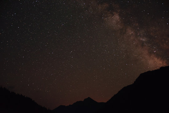 Milky Way on night sky with a lot of stars above mountains in Abkhazia