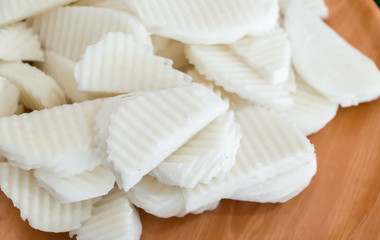 Fresh jicamas on wooden board