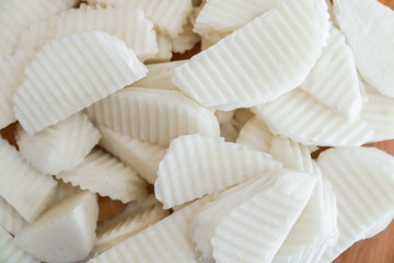 Fresh jicamas on wooden board