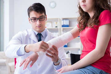 Doctor and patient during check-up for injury in hospital