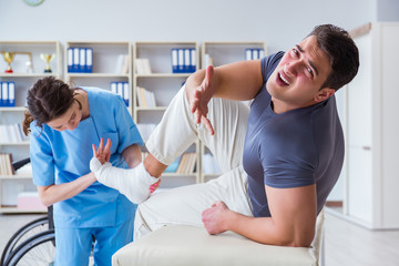 Doctor and patient during check-up for injury in hospital