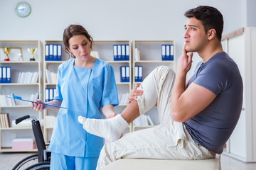Fototapeta premium Doctor and patient during check-up for injury in hospital