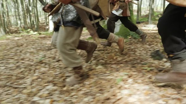 The feets of Vikings running along the slope