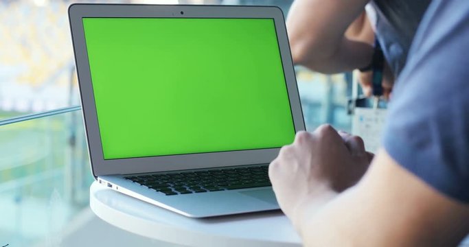 Male person man working using laptop outdoor blank green screen blur background chromakey reading mock up waiting download program networking internet surfing marketing finance modern tech 3g adware