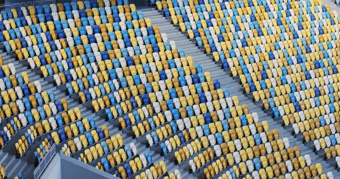 side view blue yellow white colorful empty stadium seats spectators nobody perspective architecture sport field sports audience championship sit sitting place public space arena sporting events